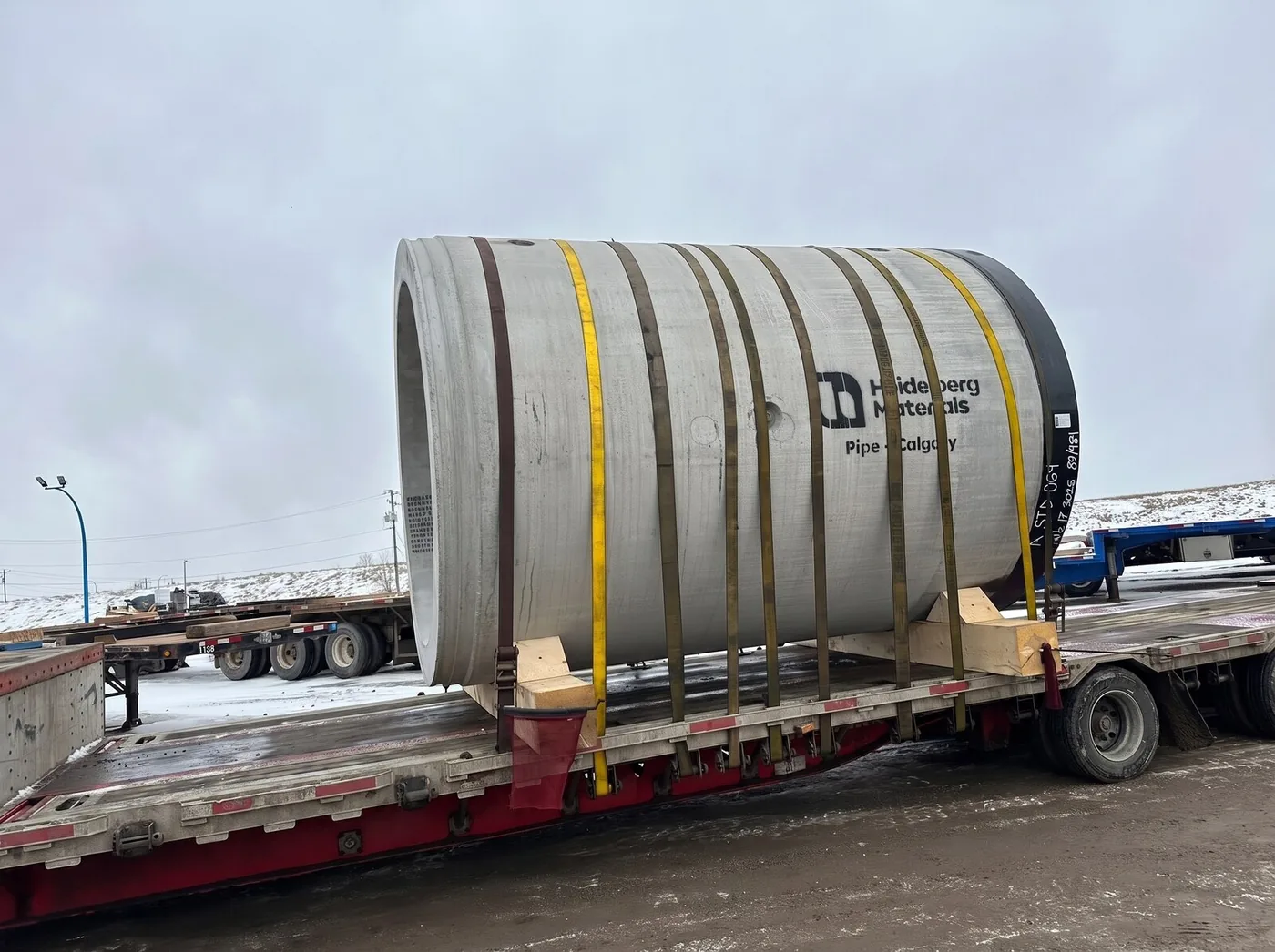 Precast concrete pipe load on lowboy