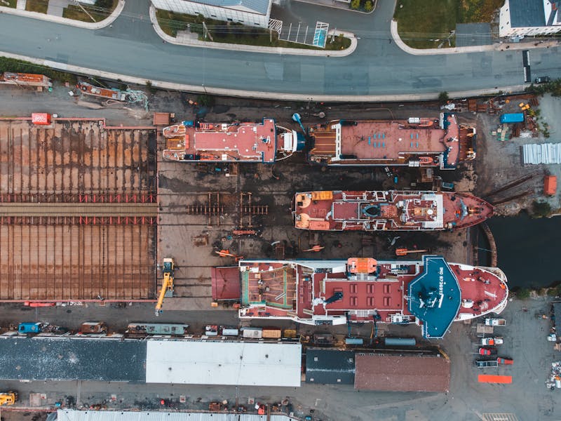 Aerial view of shipyard with docked vessels