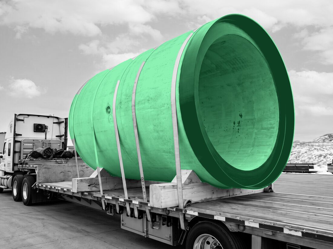 Heidelberg/Fortis precast concrete pipe section strapped to flatdeck