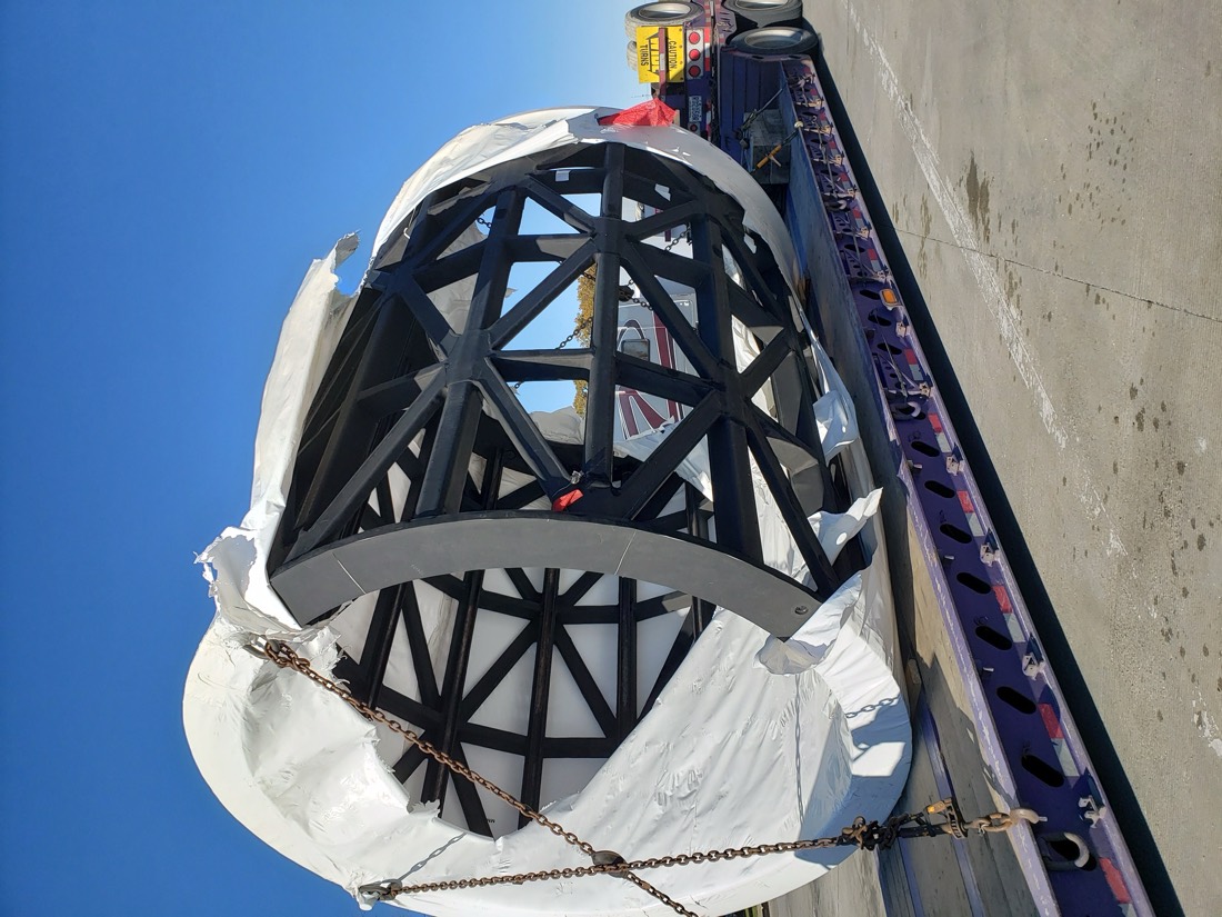 Large structural steel cylindrical framework / cage (silo or vessel internal) chain-secured on flatbed