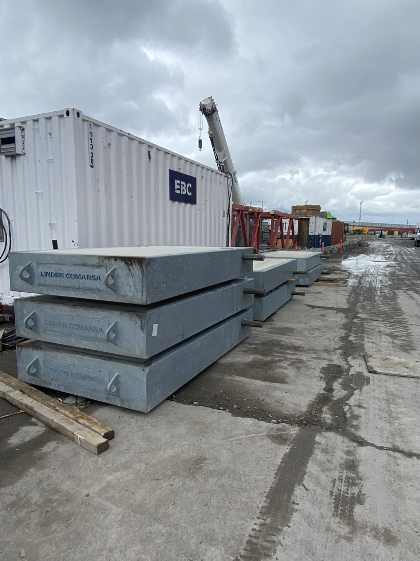 Linden Comansa tower-crane concrete ballast / counterweight blocks staged at construction site