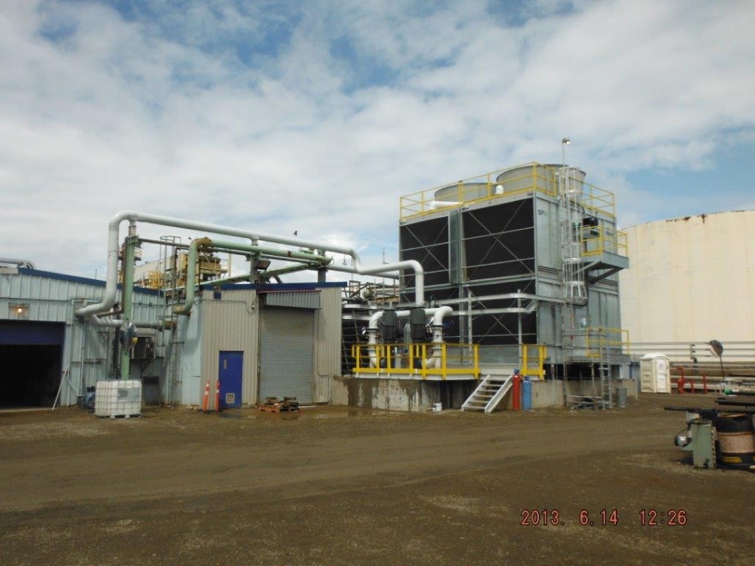Wide view of completed cooling tower installation at refinery