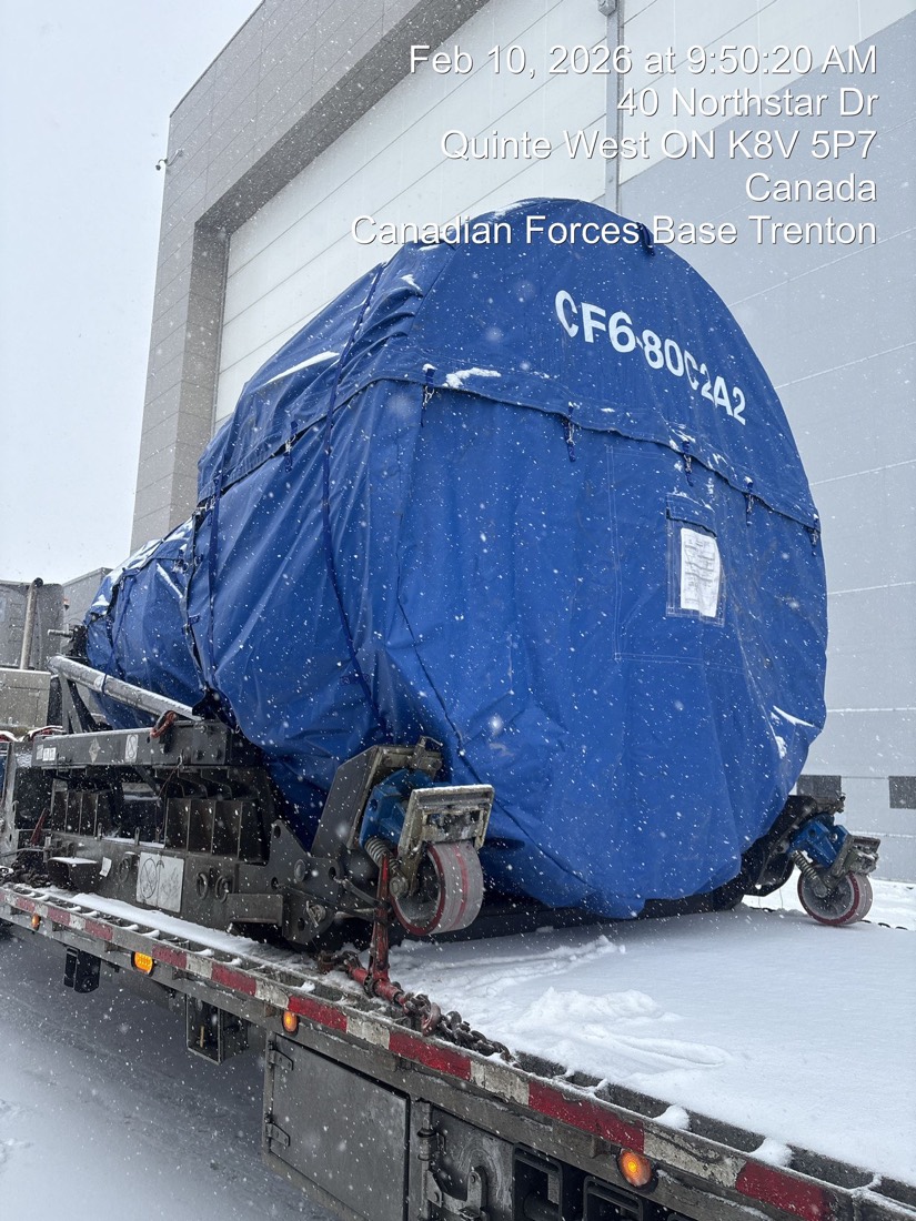 CF6-80C2 jet engine on stand under blue tarp at CFB Trenton (front view, winter)