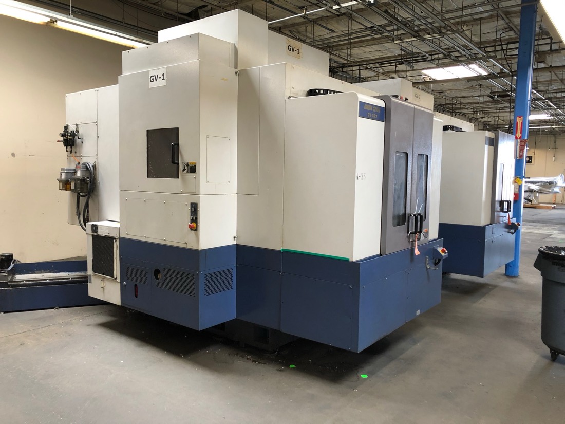 Same Mori Seiki GV-1 CNC machining center — back/side view in shop
