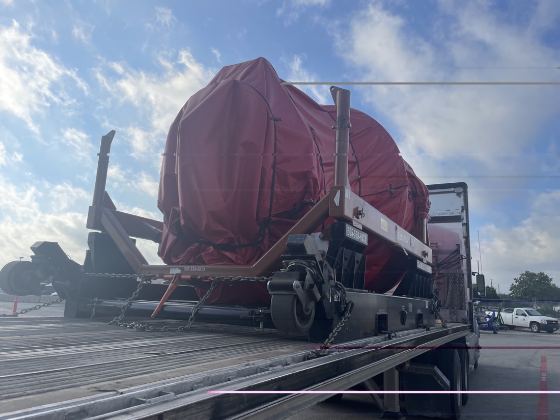 Same RB211-535 engine on stand — rear/AFT view chain-secured on flatbed