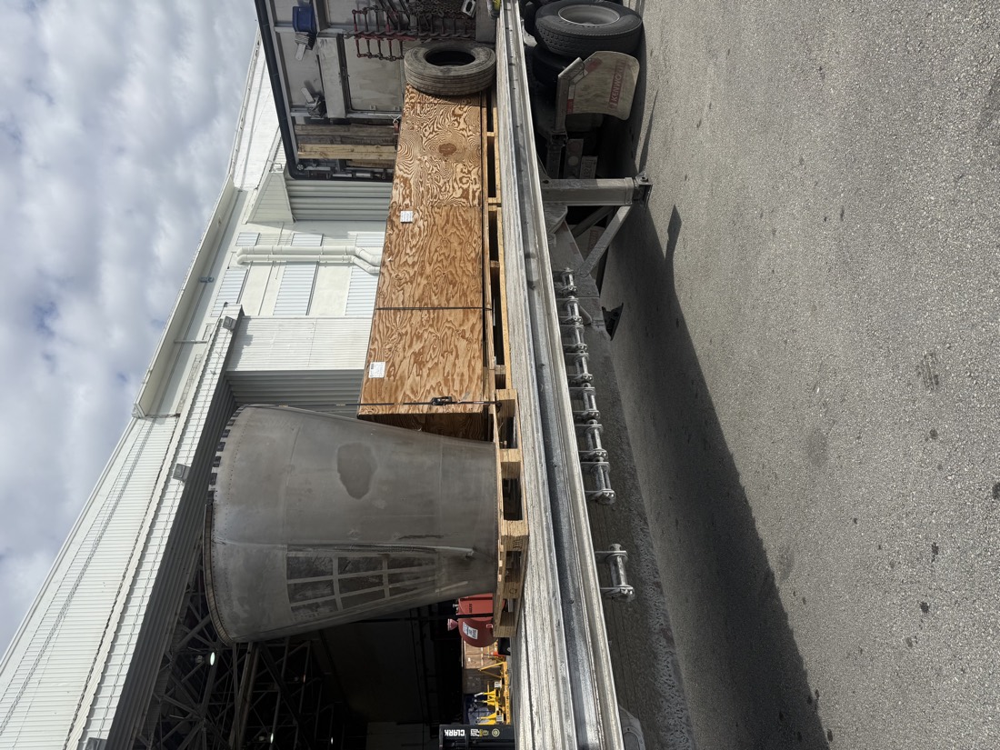 Gray industrial funnel / hopper (furnace burner or crusher cone) on flatbed