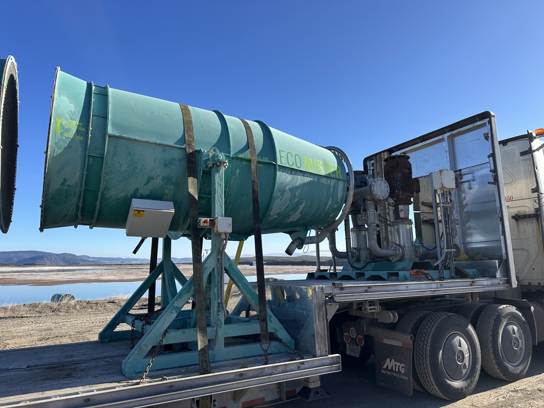 Green Eco Mist dust-suppression cannon (industrial fog cannon) on flatbed at mining site