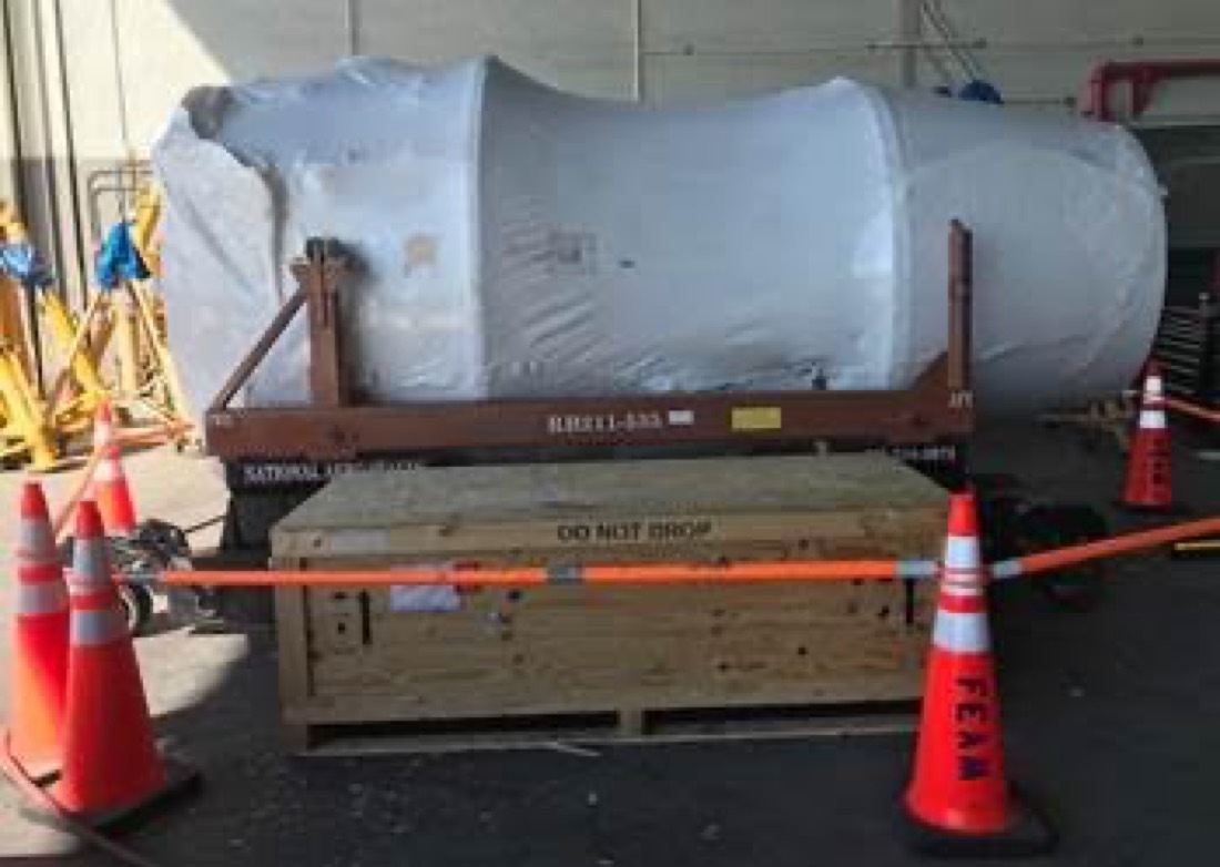 Rolls-Royce RB211-535 jet engine on National Aero Stands stand, shrink-wrapped, with DO NOT DROP wood crate