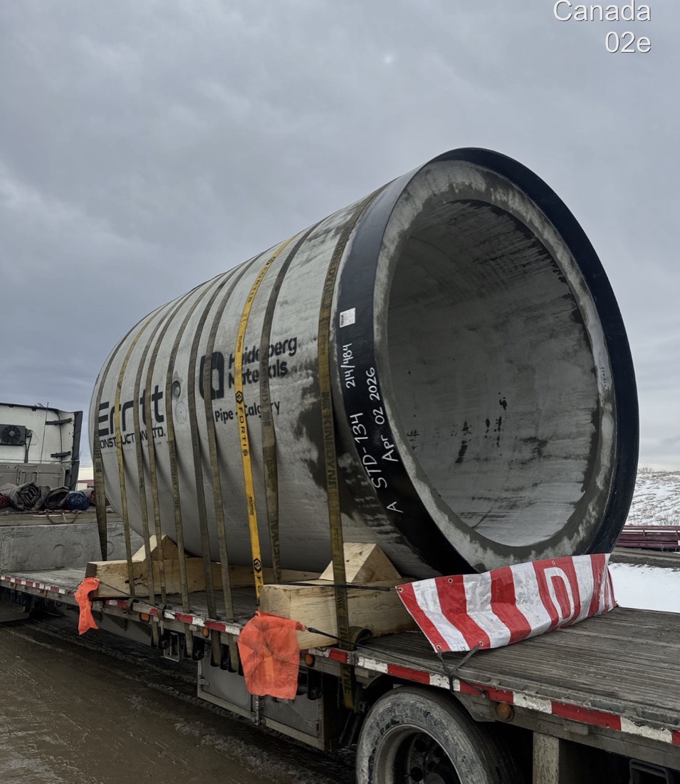 Heidelberg/Fortis precast concrete pipe section strapped to flatdeck