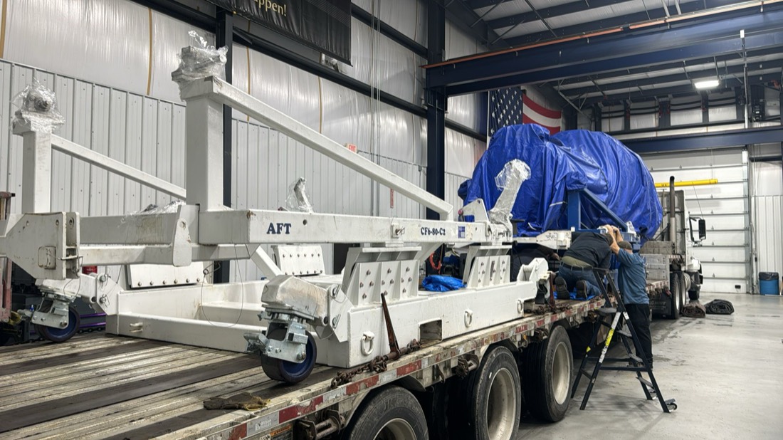 Kalitta jet engine aft transport cradle staged on stepdeck for loading