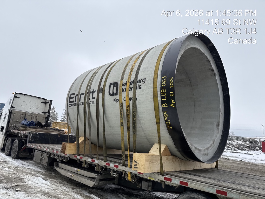 Heidelberg Materials / Erritt 7&prime; diameter precast concrete pipe section strapped on flatdeck — Calgary