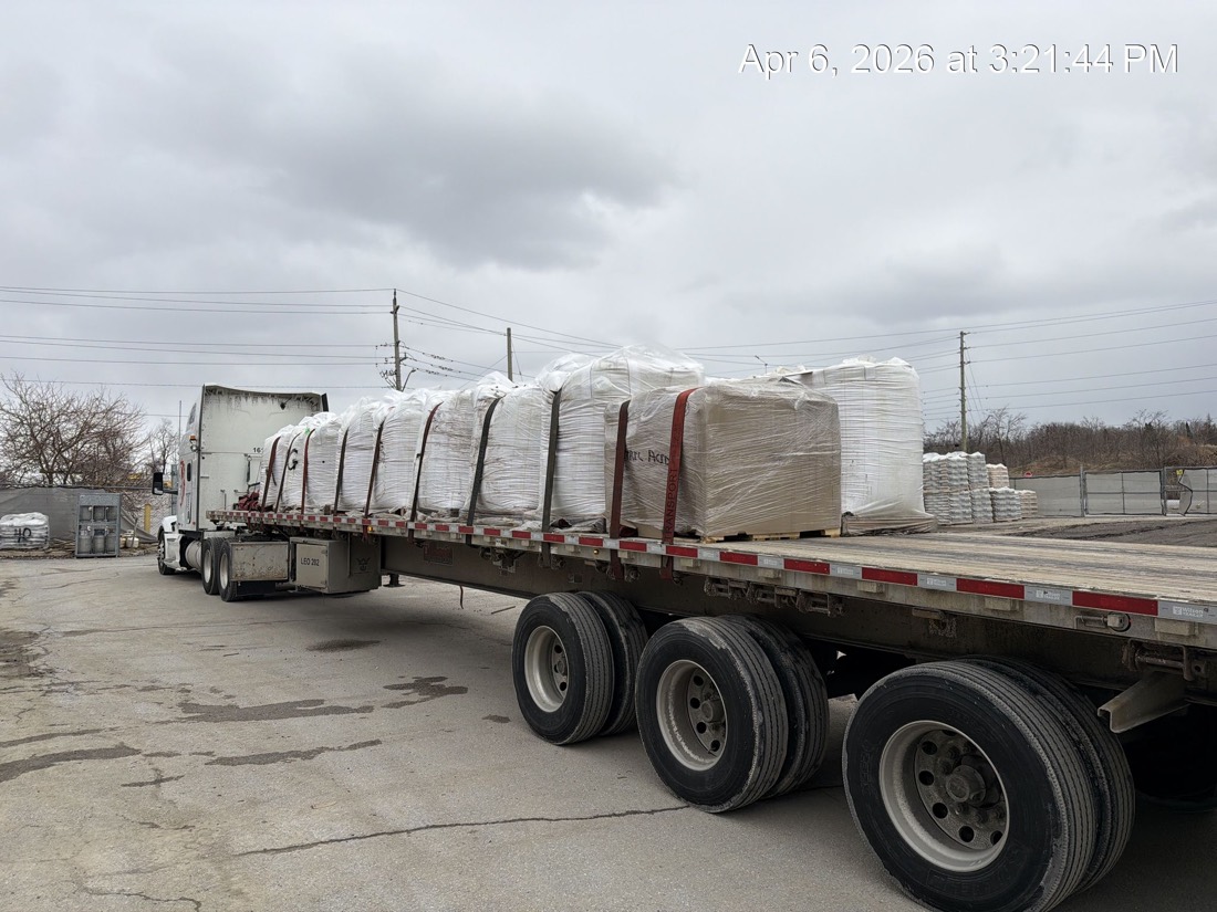 Three-quarter view of FIBC bulk-bag load with tractor coupled, ready to roll