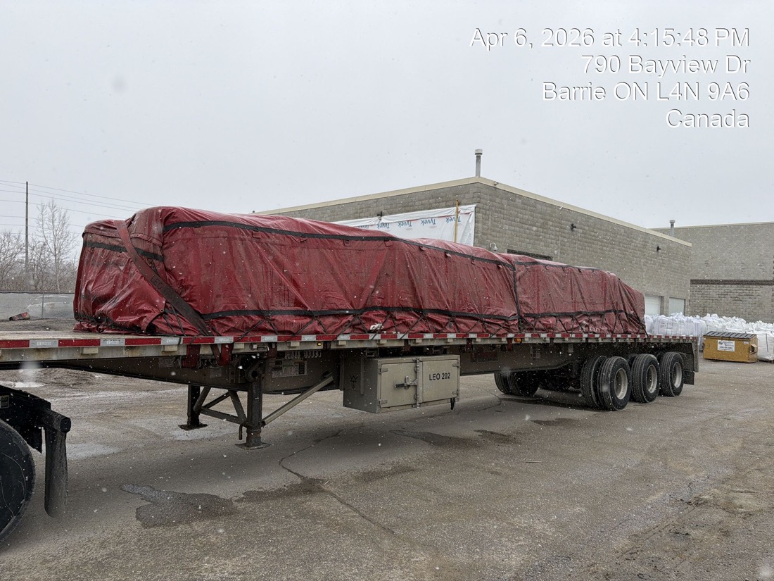 Same load now under red tarp on tridem flatdeck — Bayview Dr, Barrie ON